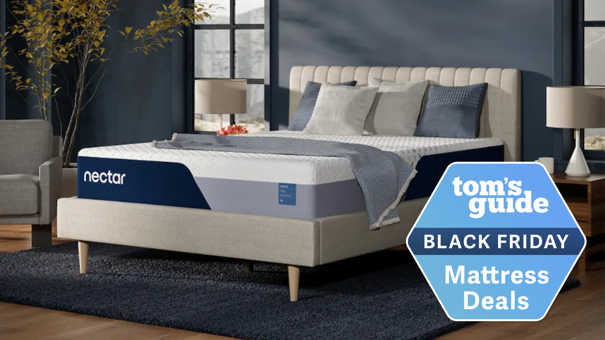 Um colchão Nectar Classic em uma cama creme em um quarto azul com etiqueta Tom's Guide Black Friday